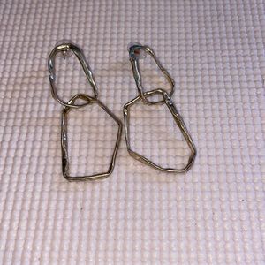 Gold long dangling earrings.